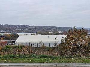 a large white building with people walking on it at Double En Suite Room Newcastle Upon Tyne in Derwent Haugh