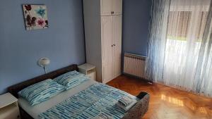 Postel nebo postele na pokoji v ubytování Apartments Ankica
