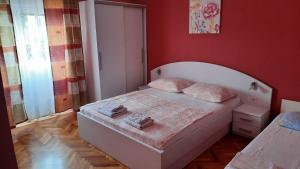Postel nebo postele na pokoji v ubytování Apartments Ankica