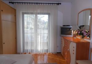 Postel nebo postele na pokoji v ubytování Apartment Dragica