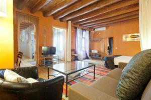 a living room with a couch and a table at Friendly Rentals Manuela in Barcelona