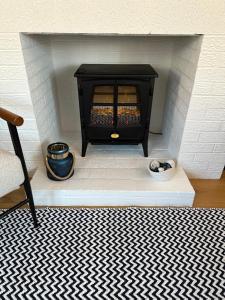 a model of a fireplace in a room at The Old Wash House in Lytham St Annes