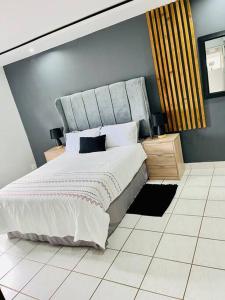 Katil atau katil-katil dalam bilik di Emanzini Self-catering guesthouse