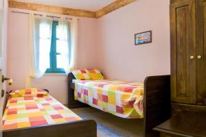 Postel nebo postele na pokoji v ubytování Villa Astrea