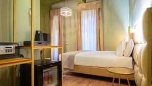 Postel nebo postele na pokoji v ubytování Navona Comfort Rooms