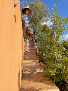 a stairway with a light on the side of a building at Domaine Pietra di Sole in Porto-Vecchio