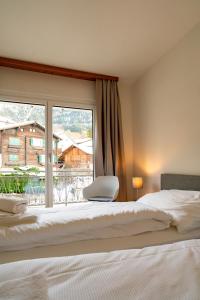 Postel nebo postele na pokoji v ubytování Hotel Restaurant Simplon