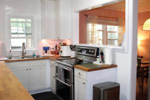 a kitchen with a sink and a stove top oven at Oldfield Escape in Decatur
