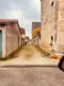 an empty street in an old brick building at La Cigogne in Châteauvillain
