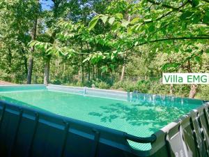 a swimming pool in a yard with trees at Villa EMG Gelsenkirchen Essen Dortmund - Gelsenkirchen in Gelsenkirchen +42 photos