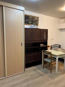 a room with a table and a table and a chair at Hostel EURO in Baku