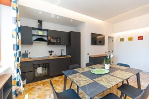 a kitchen and dining room with a table and chairs at "Maiori" Cozy 3 Bedroom, 3 Bathroom House in the Heart of Maiori in Maiori