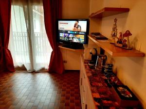 TV a/nebo společenská místnost v ubytování CIVICO 43 Interno 6 + 9 fotografií
