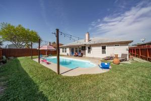 a house with a swimming pool in the yard at Blissful Heated Pool Retreat in Corpus Christi