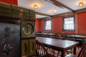 a dining room with a table and chairs at Old House - Krvavec ski resort in Cerklje na Gorenjskem