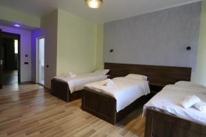 Postel nebo postele na pokoji v ubytování Green Hotel Tskaltubo