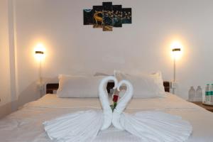 A bed or beds in a room at REST POINT GUEST HOUSE AND APPARTMNTs