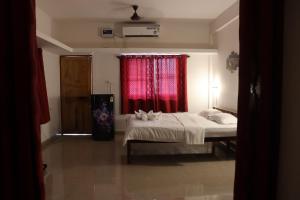 A bed or beds in a room at REST POINT GUEST HOUSE AND APPARTMNTs