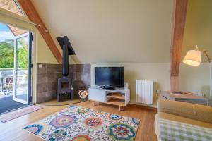Televisyen dan/atau pusat hiburan di L'Atelier - Alpine-style chalet