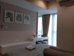 Homey 1 BR Apt at Branz BSD的休息区