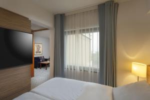 Postel nebo postele na pokoji v ubytování Maritim Hotel Darmstadt