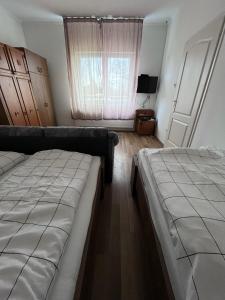 Postel nebo postele na pokoji v ubytování Arany fácán apartman