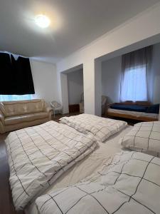 Postel nebo postele na pokoji v ubytování Arany fácán apartman