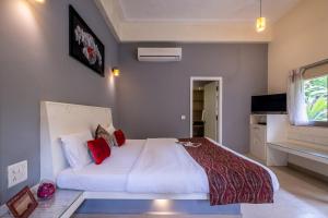 Postel nebo postele na pokoji v ubytování Gomes Oasis Goa boutique stay