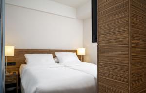Postel nebo postele na pokoji v ubytování Maritim Hotel Darmstadt