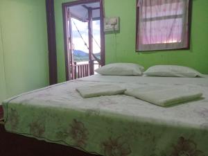 Postel nebo postele na pokoji v ubytování Sunset bar bungalows