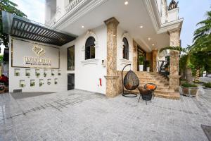 a lobby of a building with a sign that reads new hotel at Ly Ly Luxury Hotel in Ho Chi Minh City