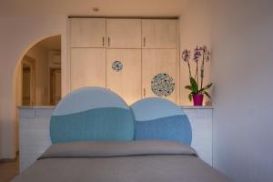Una cama o camas en una habitación de Hotel Corallaro