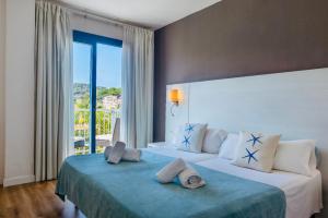 Postel nebo postele na pokoji v ubytování Hotel Miramar