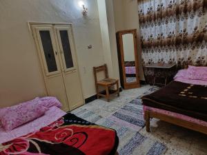 Postel nebo postele na pokoji v ubytování فندق النخيل