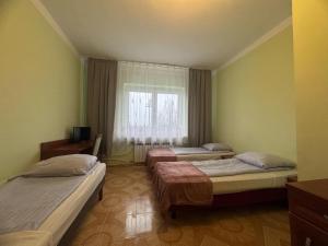 Posteľ alebo postele v izbe v ubytovaní OŚRODEK WYPOCZYNKOWY MAZOWSZE W KARPACZ