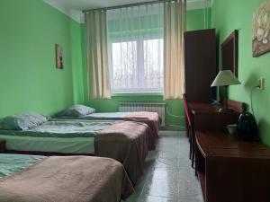 Posteľ alebo postele v izbe v ubytovaní OŚRODEK WYPOCZYNKOWY MAZOWSZE W KARPACZ