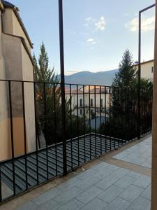 a balcony with a fence and a view of a building at Casa vacanze Sulmona centro in Sulmona