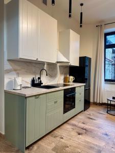 Η κουζίνα ή μικρή κουζίνα στο Saint Martin Apartment +8 φωτογραφίες