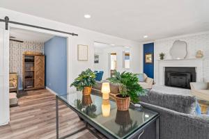 a living room with a couch and a fireplace at HotTub, FirePit, Pets, Pool Table, Outdoor Dining in Hendersonville