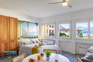 a bedroom with a bed and a table at VARENNA GUEST HOUSE 2 in Varenna