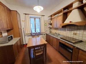 Kuchyňa alebo kuchynka v ubytovaní Maison La Pila + 13 fotografií