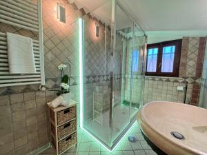a bathroom with a shower and a sink and a tub at Casa di Roberto in Ladispoli +25 photos