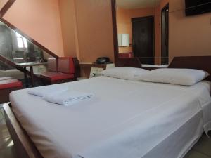 Postel nebo postele na pokoji v ubytování Hotel BCentral - centro de Belo Horizonte
