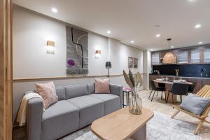 a living room with a couch and a table at ULIV Antara in Mexico City