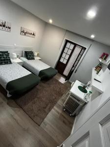 an overhead view of a bedroom with two beds at Casa Pirosa2 in Aveiro