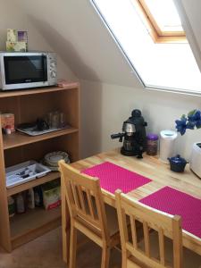 Et tv og/eller underholdning på Ezo Apartmanház Balatonberény