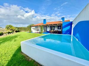 a house with a swimming pool in a yard at Comporta - Wood & Blue in Comporta