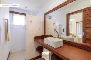 a bathroom with a sink and a mirror at Paraíso de Luxo à Beira-mar no Fortim in Maceio +103 photos