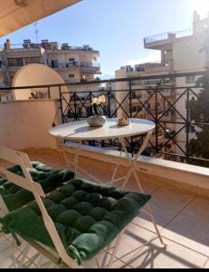 a table and chairs on top of a balcony at Siame in Drama +14 photos