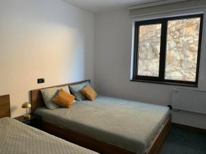 Postel nebo postele na pokoji v ubytování Apartman Glečer Vila Bela Reka + 5 fotografií
